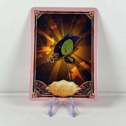 Carte Hazbin Hotel 41/50 :  SIR PENTIOUS' RAY GUN Foil